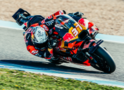 Red Bull racing motorbike with a motorcyclist racing it around a corner