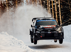 Car driving fast down the road