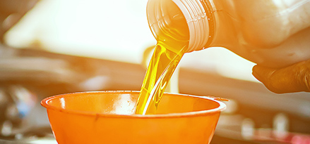 Hand pouring oil